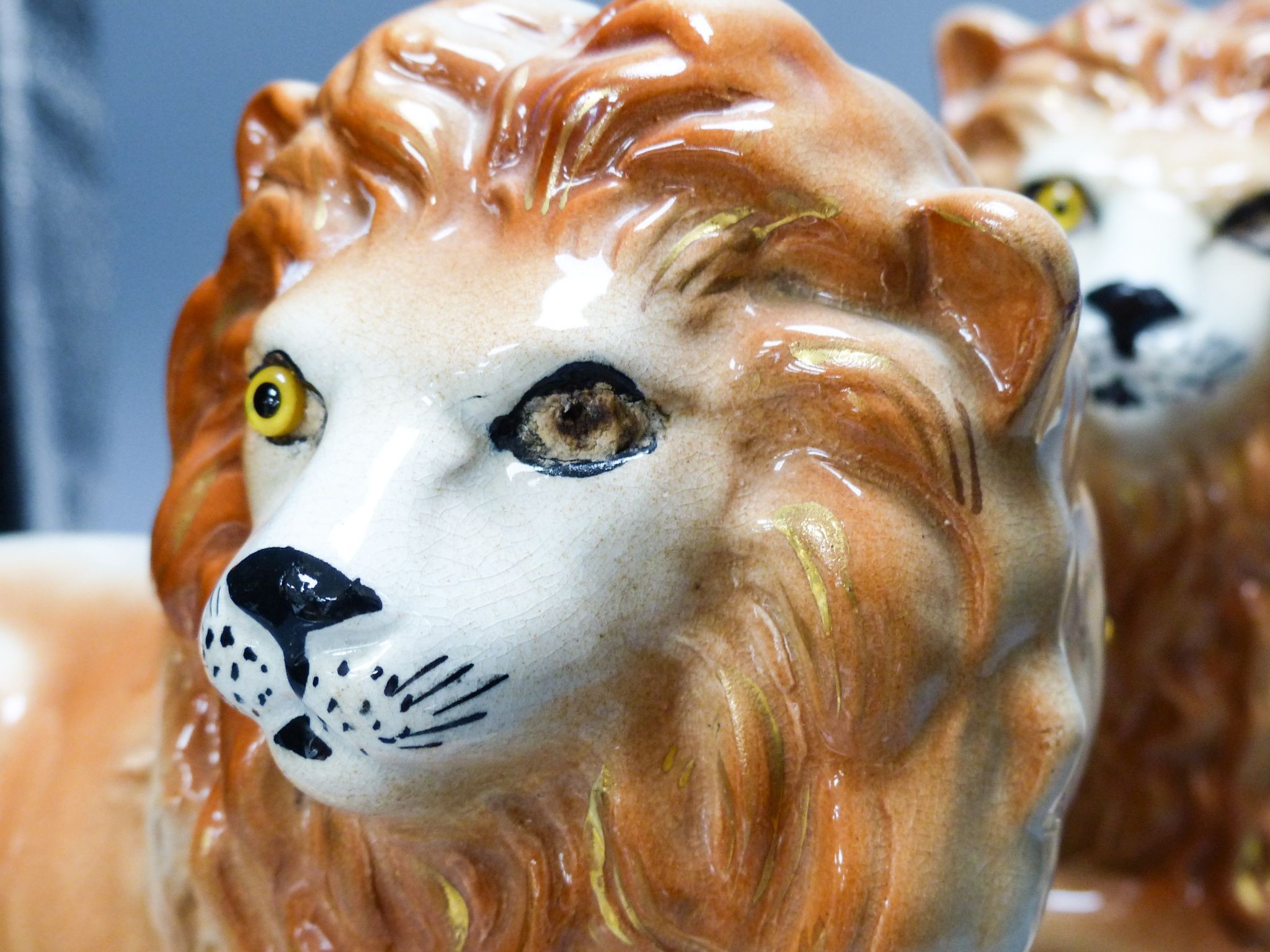 A pair of Staffordshire pottery 'lion' figures 30cm